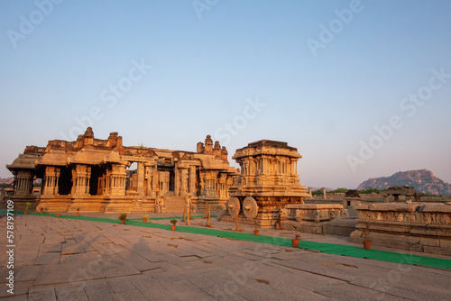 Vijaya Vitthala temple in Hampi with stone charriot in the background photo