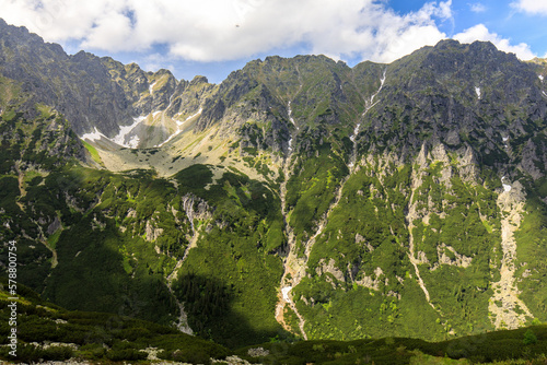 Tatra mountain cliffs and waterfalls in summer as seen from Dolina Roztoki. Polish Tatra mountains