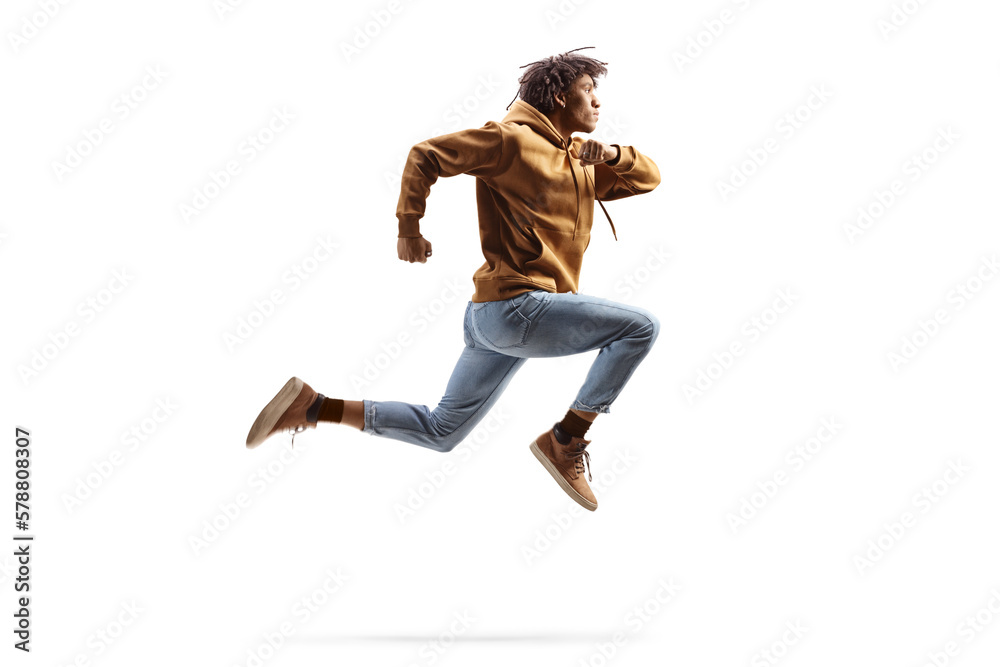 Full length profile shot of a young african american guy jumping