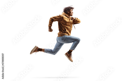 Full length profile shot of a young african american guy jumping photo