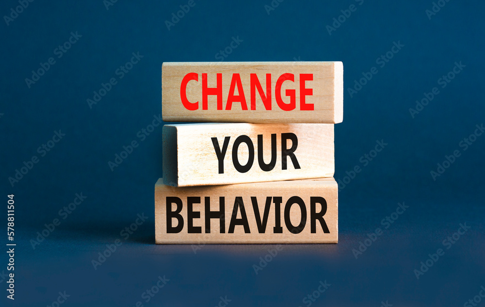 Motivation and Change your behavior symbol. Concept words Change your behavior on wooden block on a beautiful grey table grey background. Business change your behavior concept. Copy space.