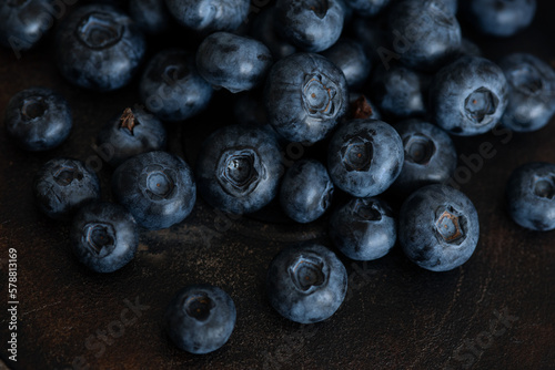 Blueberries in a bowl. Blueberries on a dark aged background.