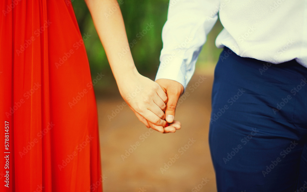 Wedding couple, bride and groom holding hands in the park Wedding couple, bride and groom holding hands in the park