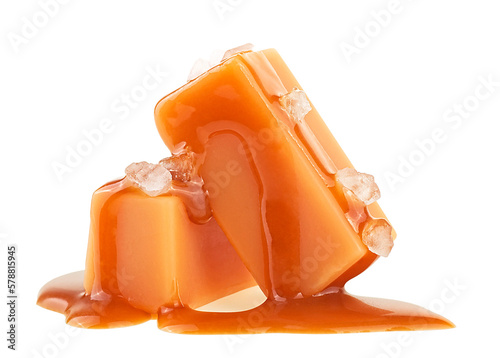 Delicious candies with caramel sauce and sea salt isolated on a white background photo