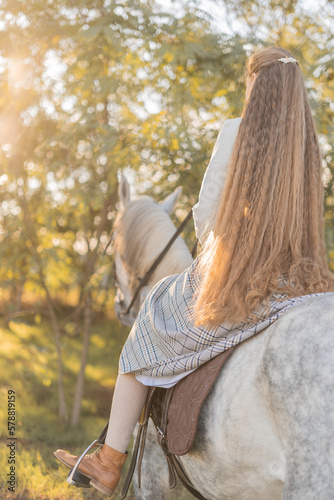 girl with long hair with a horse photo