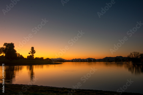 Fototapeta Naklejka Na Ścianę i Meble -  Sunrise Over Lake in Fountain Hills Arizona
