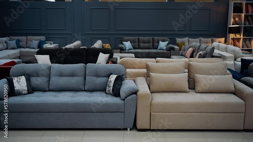 Video shot in a sofa store. A wide range of gray, brown, purple sofas. 4k videos, home concept.