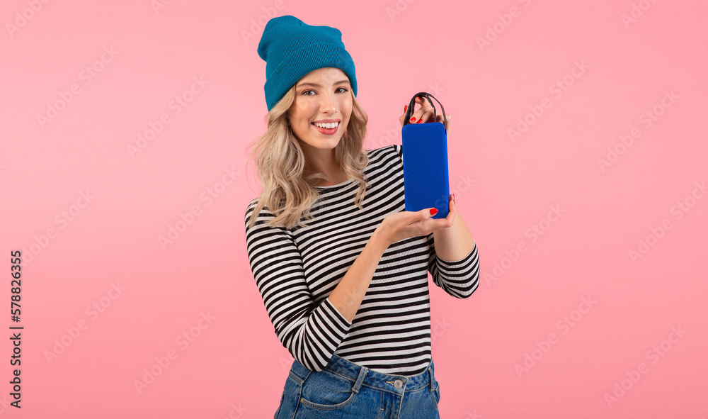 young woman holding music speaker young woman holding music speaker