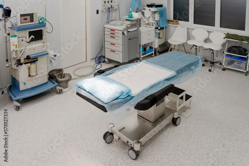 Sterile room  operating room. In the center is an operating table covered with a diaper. Modern  equipped operating room  important equipment for maintaining vital activity of the body during surgery.