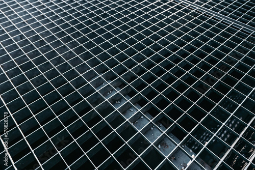 Wallpaper Mural metal grid of square holes background. Gray street lattice Torontodigital.ca
