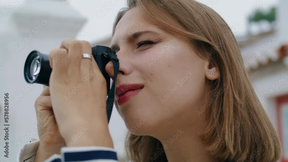 Closeup tourist taking photos with old fashioned camera. Blonde girl checking Closeup tourist taking photos with old fashioned camera. Blonde girl checking