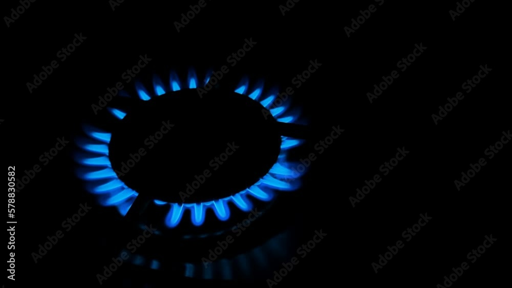 Methan gas kitchen stove while burning on dark background,not renewable energy supplies cost crisis