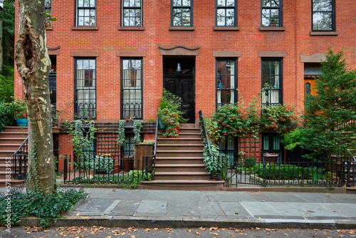 a view of a row of historic brownstones in an iconic neighborhood of Manhattan, New York City
