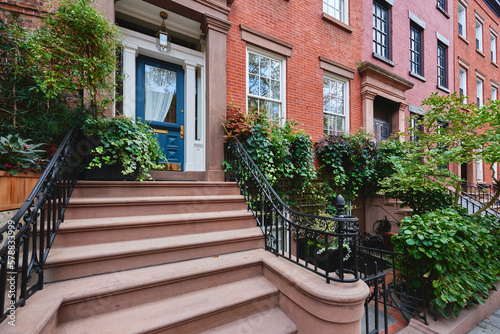 a brownstone building on an iconic street in Manhattan, New York City