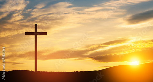 Stampa su tela Christian cross on hill outdoors at sunrise