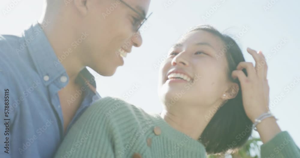 Happy biracial couple embracing on promenade, in slow motion Happy biracial couple embracing on promenade, in slow motion
