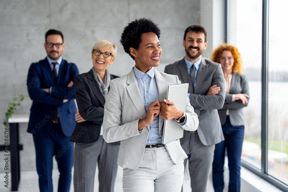 Portrait of business group standing and looking at camera Portrait of business group standing and looking at camera