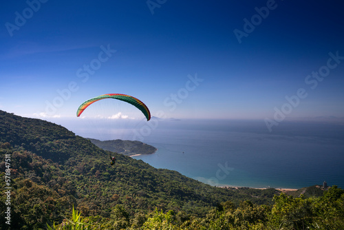 Da Nang city, Quang Nam province, Vietnam - June 25, 2017: flying paragliding on top of Son Tra Mountain. This is a regular activity of parachute flying club