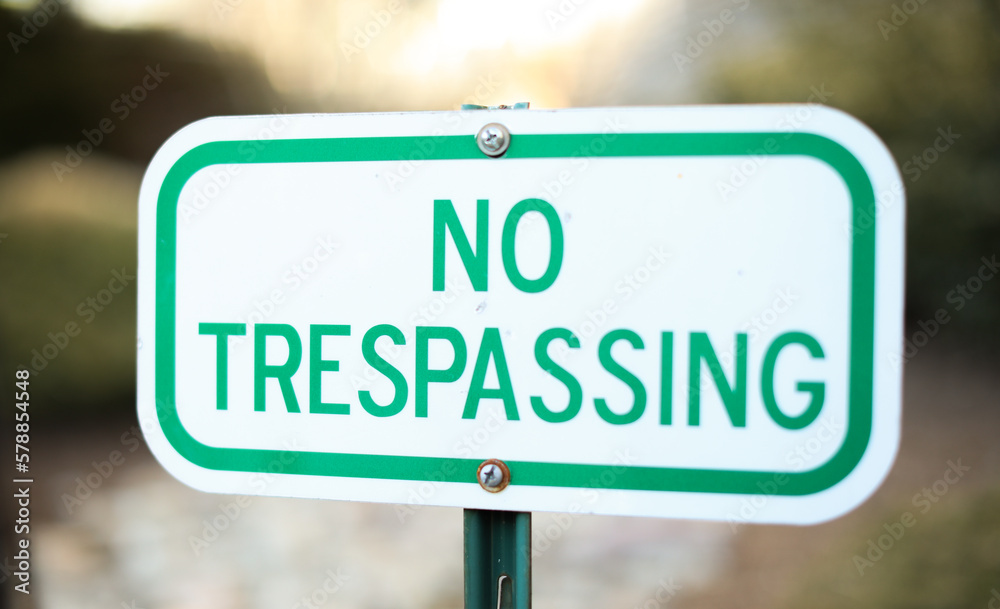 No Trespass sign in front of private property depicting security, privacy, and protection No Trespass sign in front of private property depicting security, privacy, and protection