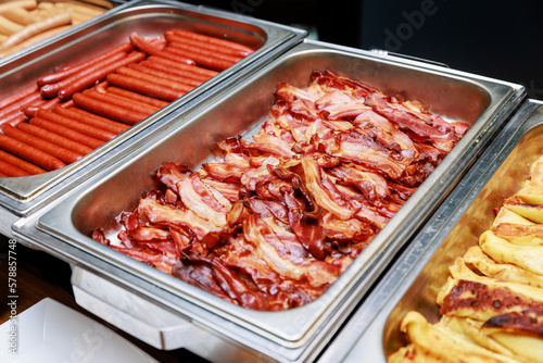 Fried bacon at the hotel breakfast buffet.