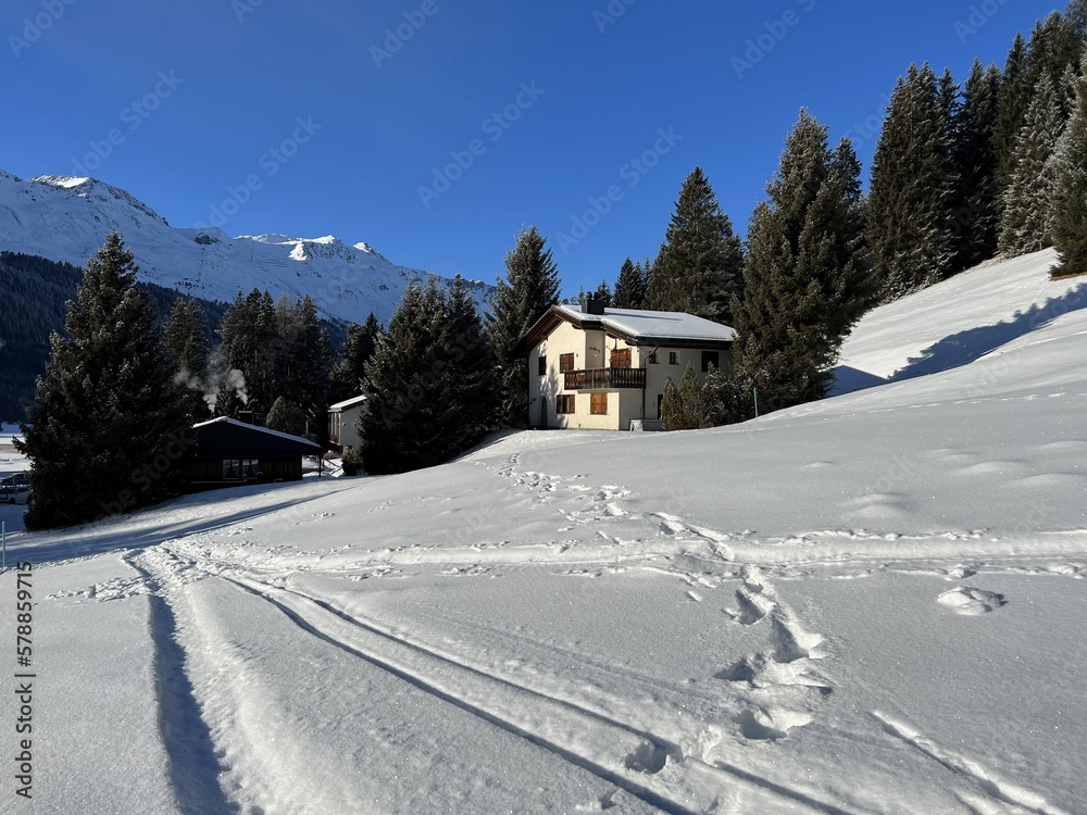 Fototapeta premium Wonderful winter hiking trails and traces after the winter snowfall above the tourist resorts of Valbella and Lenzerheide in the Swiss Alps - Canton of Grisons, Switzerland (Schweiz)