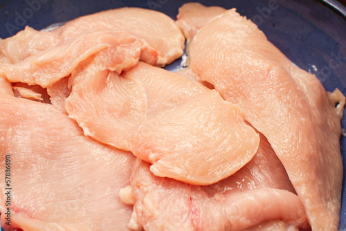 Raw chicken meat breast, seasoned, close up view
