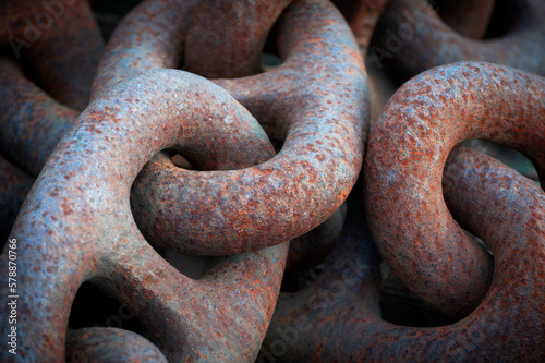 Close Up of an Old Rusty Anchor Chain. Rusty and intertwined anchor chain makes for a graphic image shapes and textures.