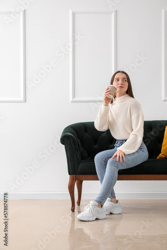 Young woman with cup of cof...