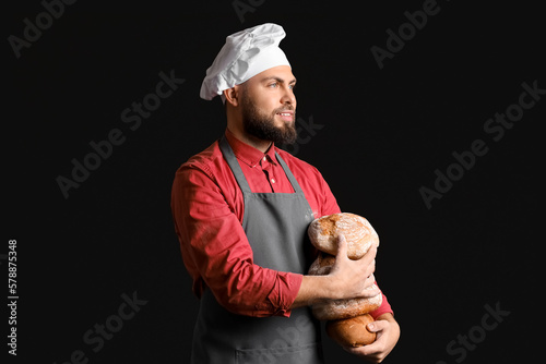 Smiling male baker in chef ...