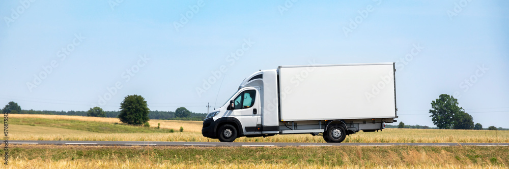 Delivery truck on the road - obrazy, fototapety, plakaty 