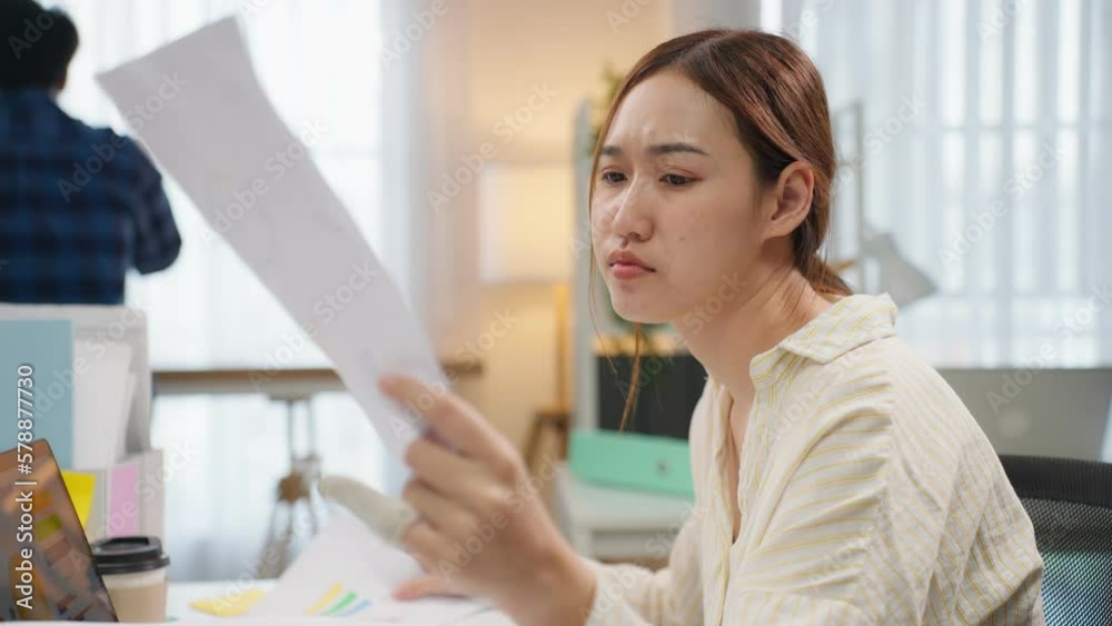 Frustrated Asian young businesswoman overwork late in office workplace