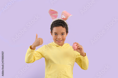 Happy young boy in bunny ea...