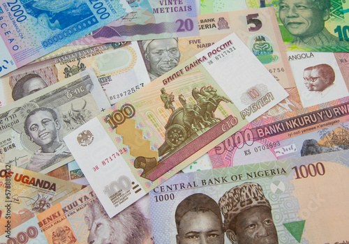 Wallpaper Mural A collection of African currencies with a one hundred ruble bank note sitting on top Torontodigital.ca