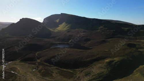 Pan across the Quiraing rock formation with Loch Cleat at the Trotternish Ridge Isle of Skye Scotland photo