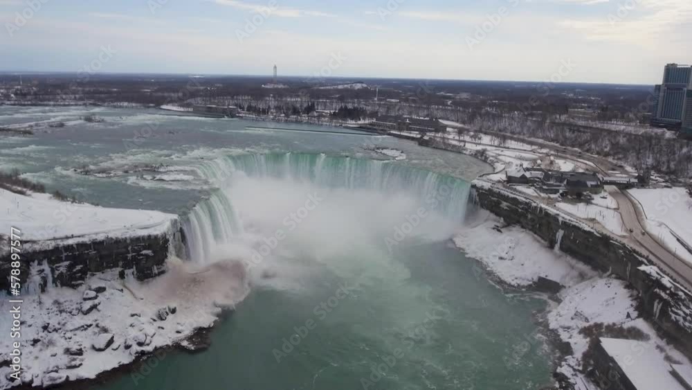 Misty Horseshoe Falls at winter in Niagara Falls, high forward aerial Misty Horseshoe Falls at winter in Niagara Falls, high forward aerial