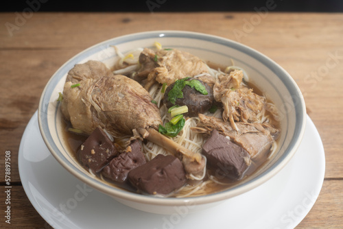 Duck noodles in bowl on wooden table  Thai food.