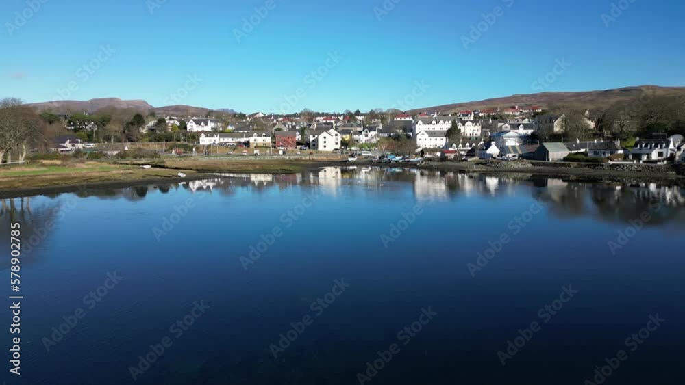 Flight over diving platform harbour and port buildings of Portree Isle of Skye Scotland Flight over diving platform harbour and port buildings of Portree Isle of Skye Scotland
