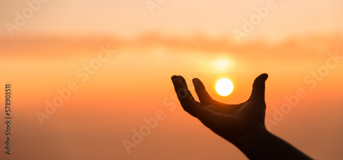 Silhouette of woman hand praying spirituality and religion, banner and copy space of female worship to god. Christianity religion concept. Christians person are pray humility humble to god.