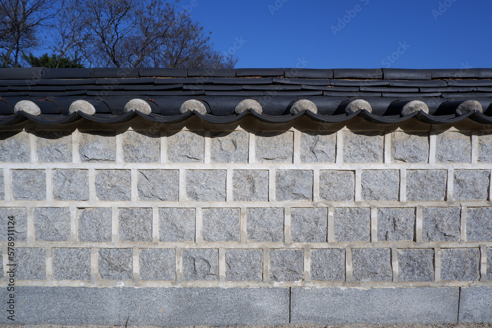 Traditional brick wall and tile roof. Korean traditional historic building wall. brick wall material for background and design.