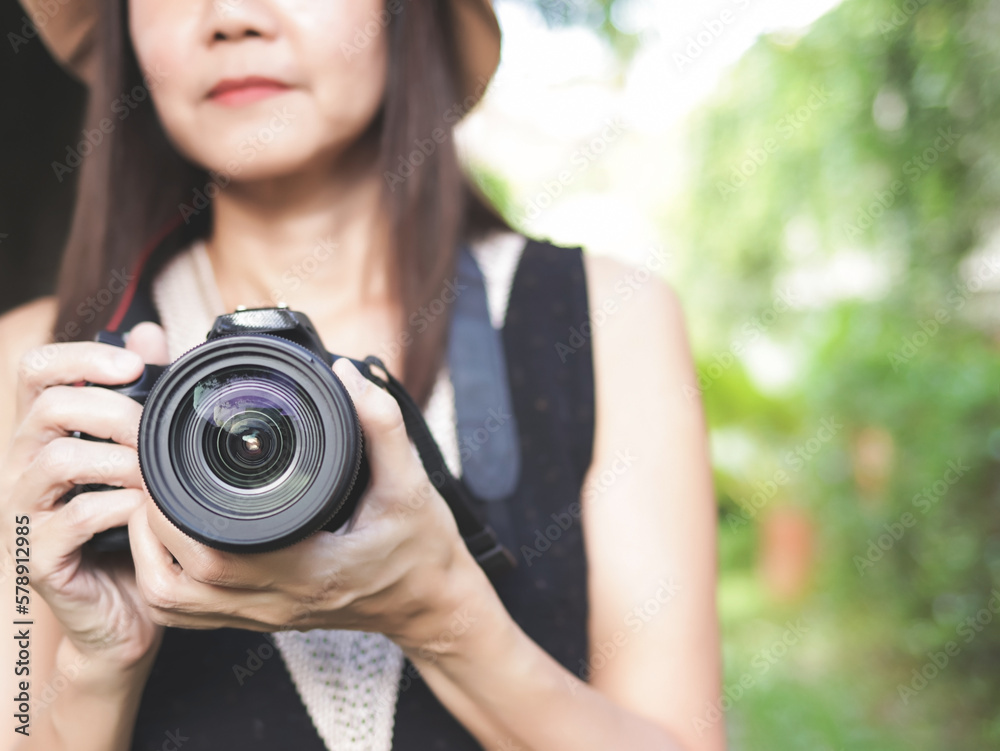 digital camera in Asian female tourist or photographer hand. digital camera in Asian female tourist or photographer hand.
