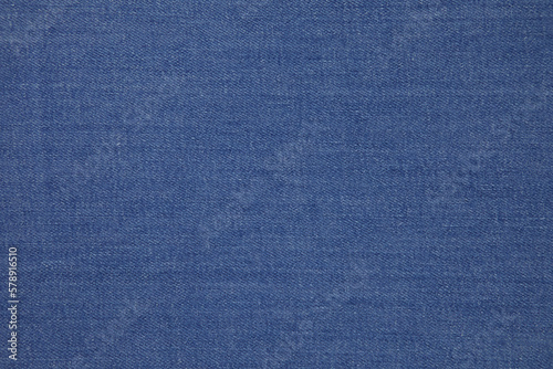 Blue jeans fabric background texture. Blue jeans fabric cloth textile material.