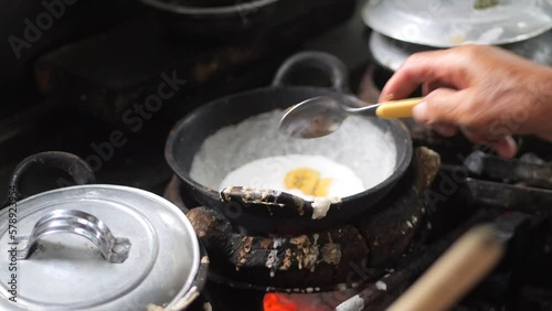 Preparing tongseng kambing. Tongseng is an Indonesian Central Java goat meat muttonor beef stew dish in curry-like soup with vegetables and sweet soy sauce. Preparing Goat Curry or Lamb Curry photo