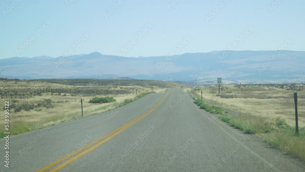 Open Desert Road Through Car Window While Driving Open Desert Road Through Car Window While Driving