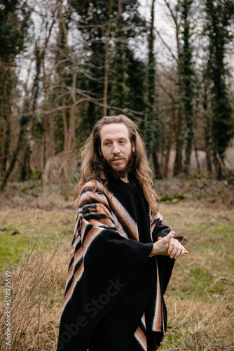 portrait of a man with long hair in the woods © Tanya Maury