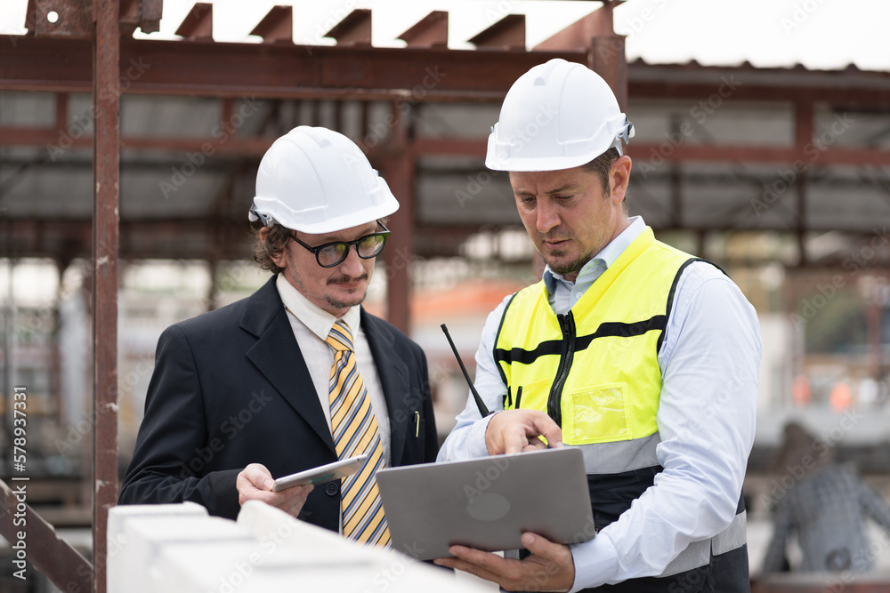 Portrait caucasian engineer man working with team engineer at precast site work Portrait caucasian engineer man working with team engineer at precast site work