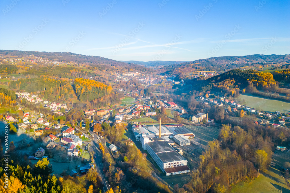 The village of Plavy situated in a sunny autumn hilly landscape, Czech Republic. Aerial view from a drone.
