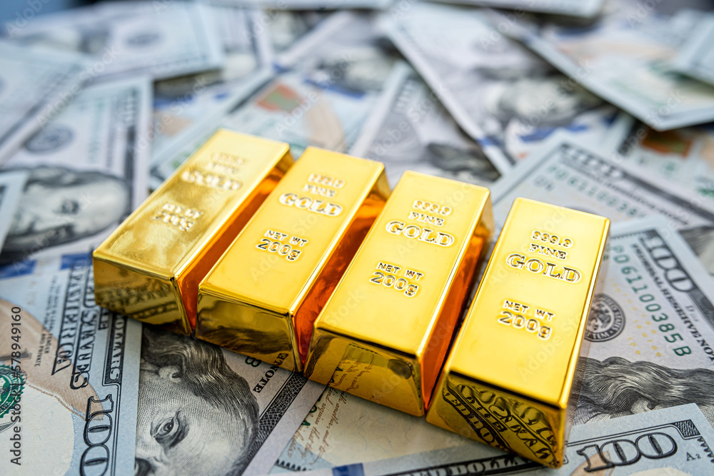 gold bars over dollar money bills, investment saving concept gold bars over dollar money bills, investment saving concept