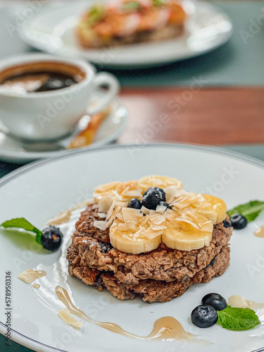 Healthy Breakfast Pancake oatmeal topped with bananas and blueberries