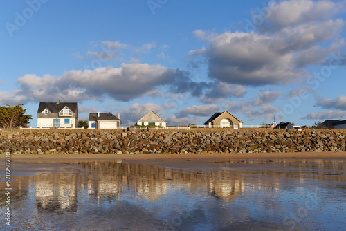 Beach and riprap of Jullouville in the Cotentin coast photo