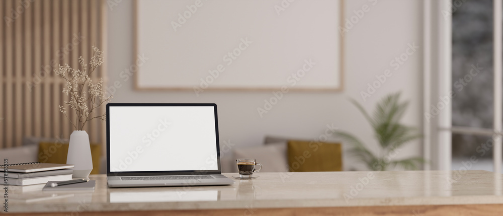Obraz premium Workspace with laptop mockup and copy space on tabletop in minimal living room.